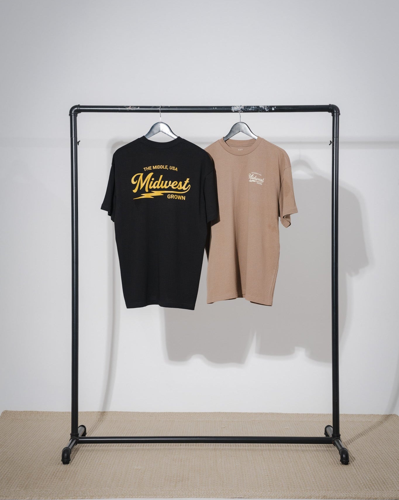 Black and walnut color t-shirt with 'Midwest' text from the brand midwest grown