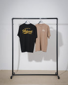 Black and walnut color t-shirt with 'Midwest' text from the brand midwest grown